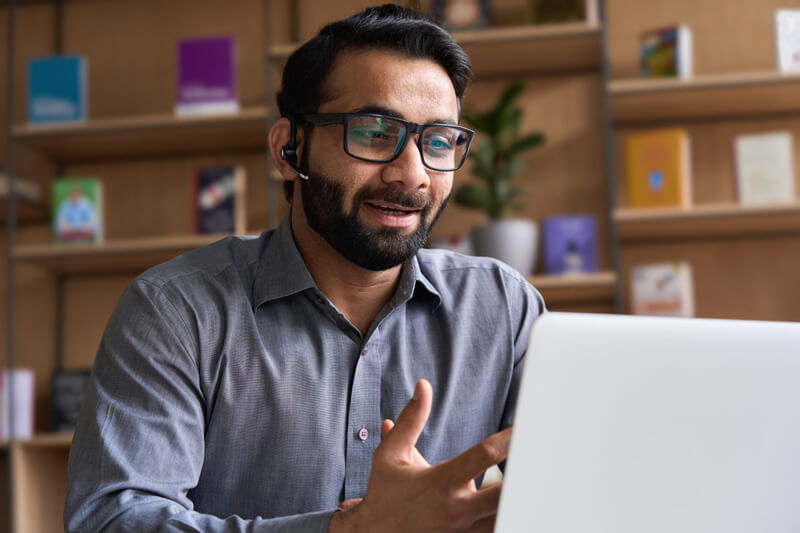 A man learning how to be a home support worker from home using a computer